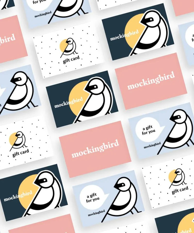 A collage of gift cards featuring a stylized bird illustration and the word "mockingbird" in various layouts and colors, including pink, blue, and white backgrounds.