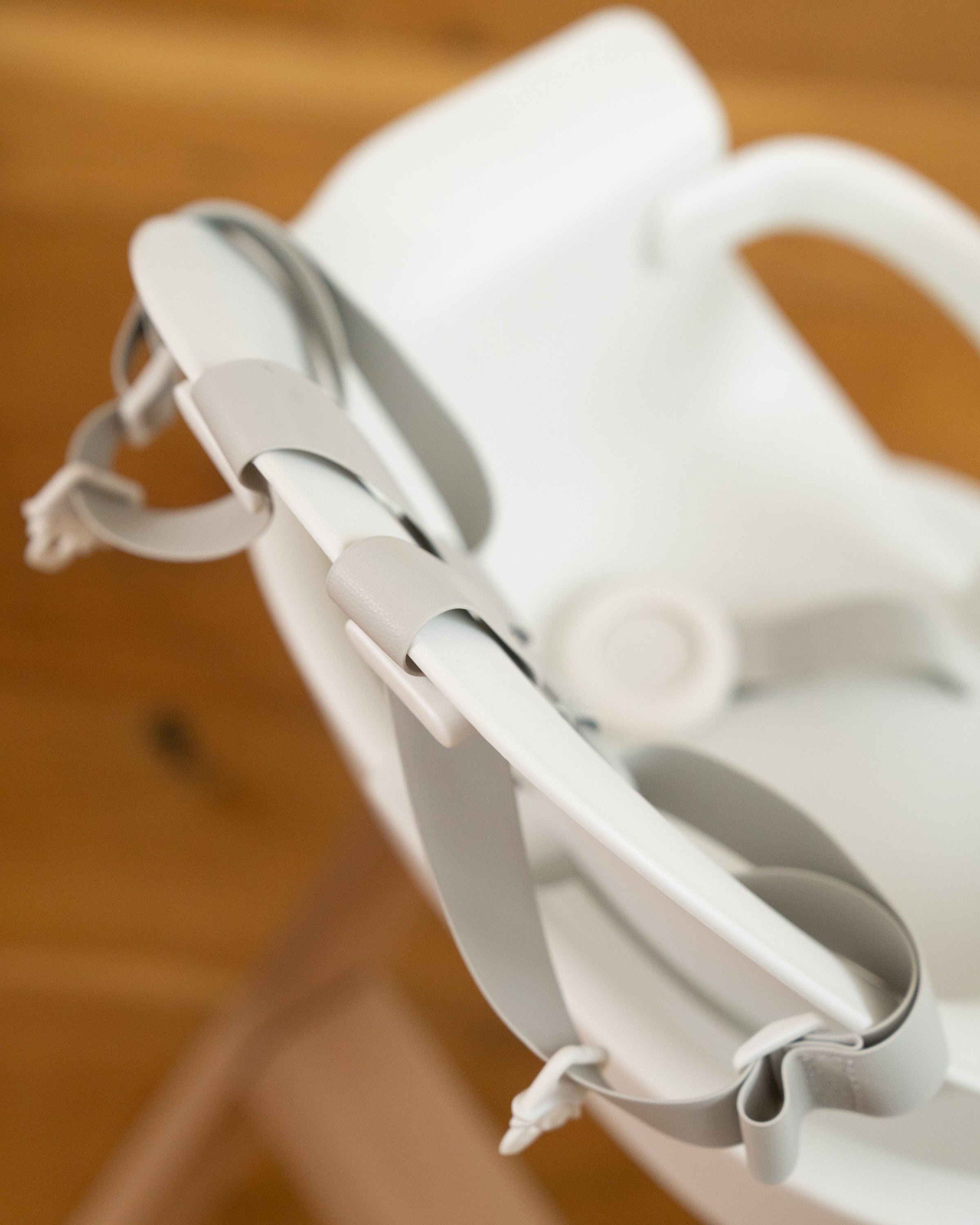 back view showing the back strap hooks on the mockingbird high chair