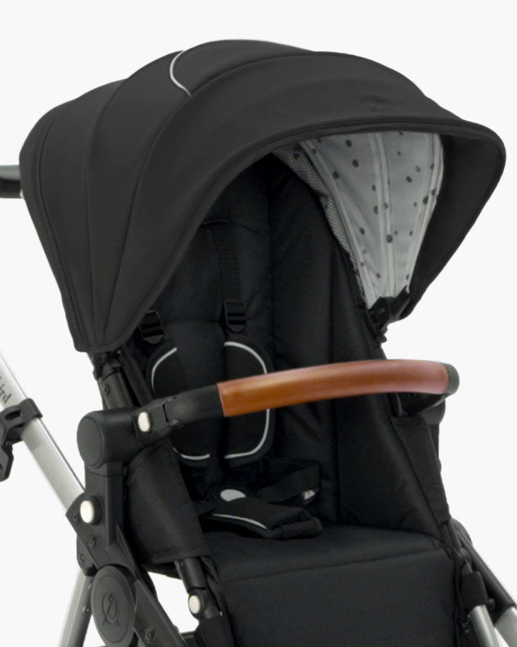 Modern black mockingbird-prod Extra Stroller Canopy 2.0 with a wooden handlebar and a polka dot interior, isolated on a white background. #color_black