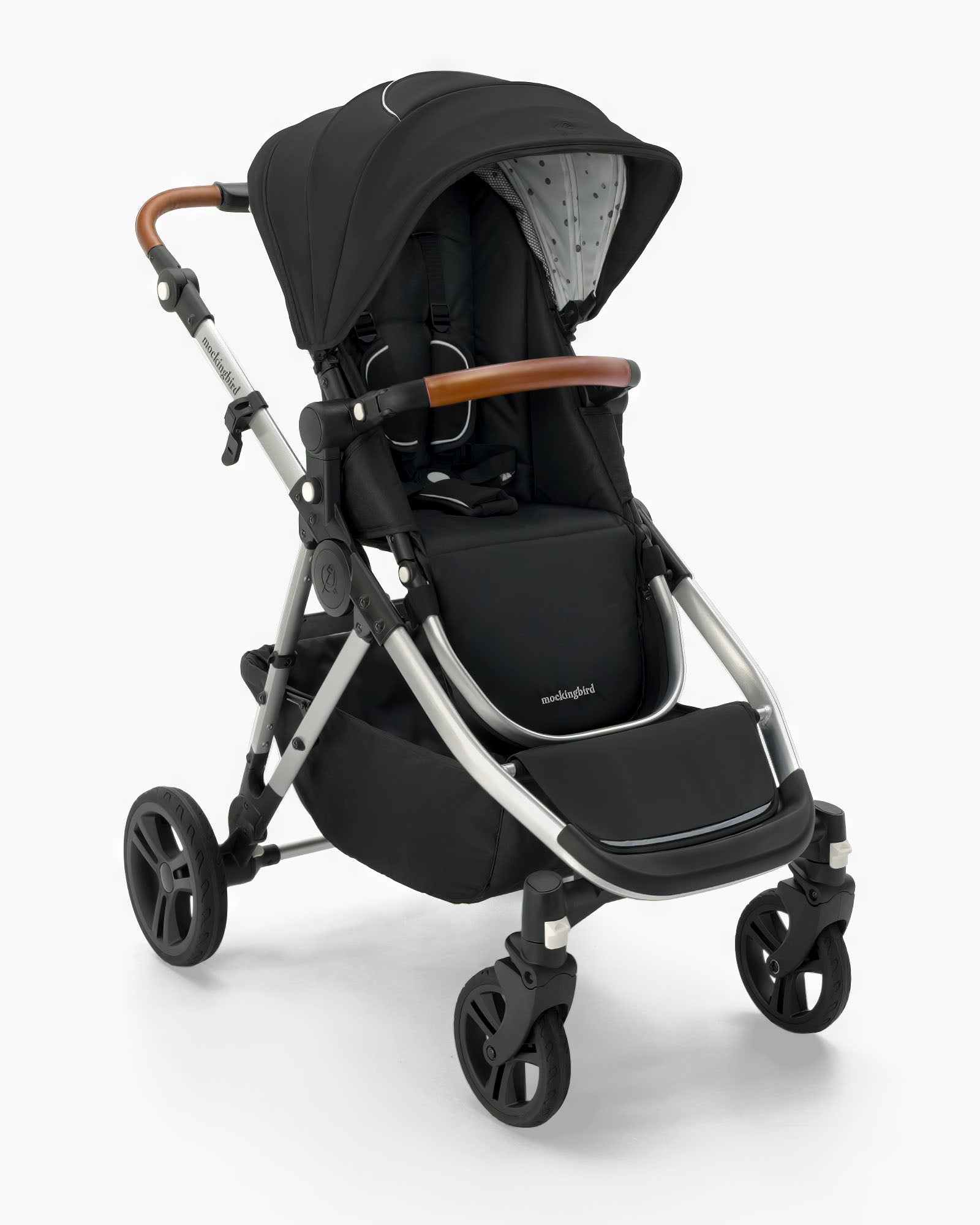Modern black Mockingbird Single-to-Double Stroller 2.0 baby stroller with adjustable handle, large wheels, and a full canopy, isolated on a white background. #color_black