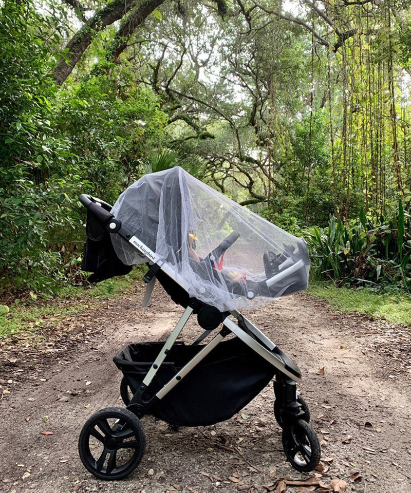 Mockingbird Stroller on a nature path using the Mosquito Net