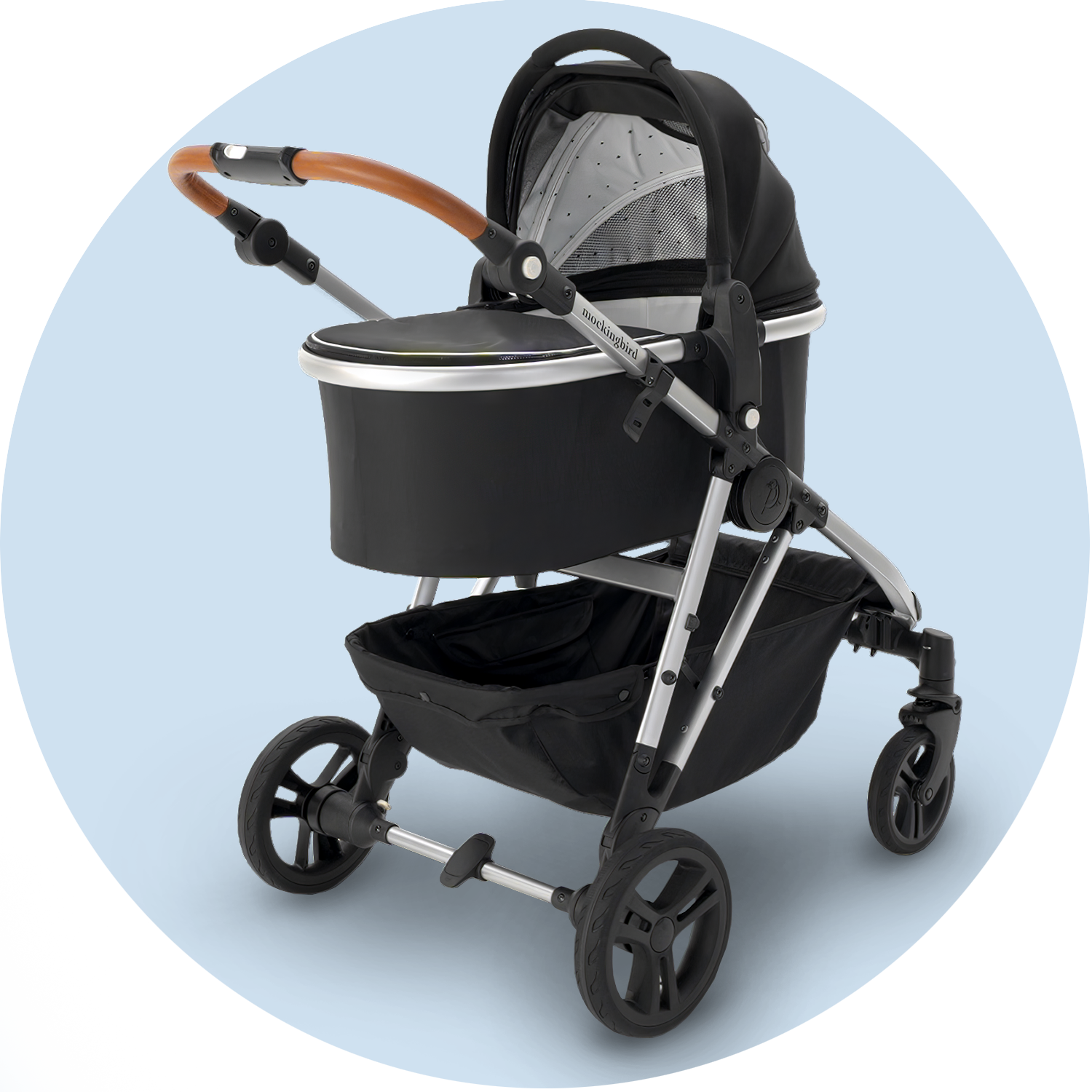 Modern black baby stroller with adjustable handle and large wheels, displayed on a plain light blue background.