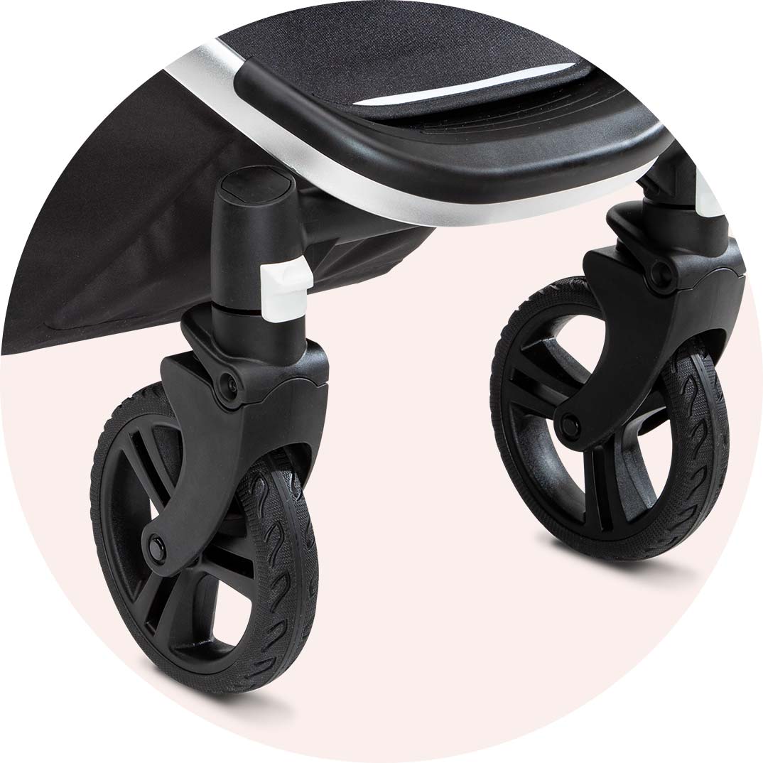 Close-up view of a modern baby stroller's black wheels and a section of the seat, prominently showing the wheel design and lock mechanism on a dual-tone background.