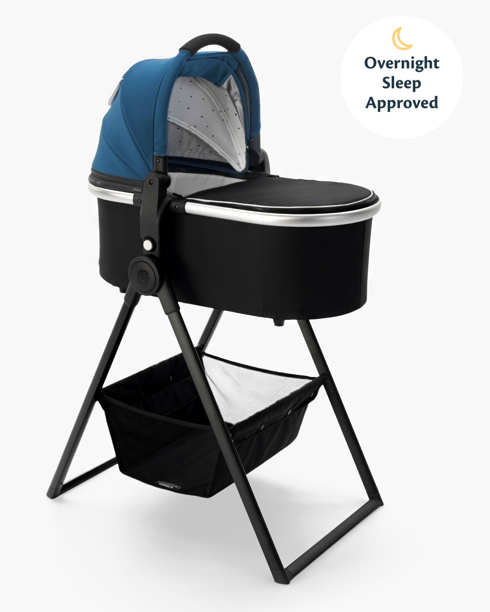 A modern baby bassinet with a blue canopy on a mockingbird-prod bassinet stand, featuring a storage basket underneath and labeled as "overnight sleep approved. #color_sea