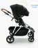 A modern black baby stroller with an extendable canopy, labeled, and shown against a white background.