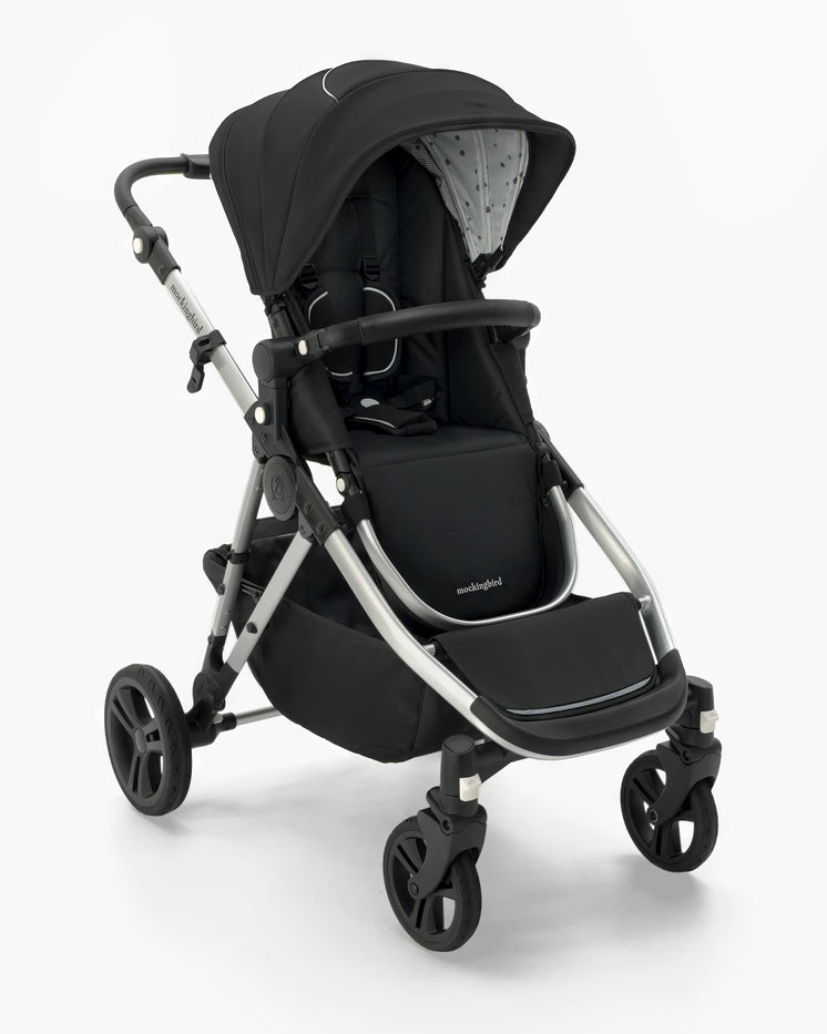 A modern black mockingbird-prod baby stroller with an adjustable canopy and a reclining seat on a white background.  #color_black