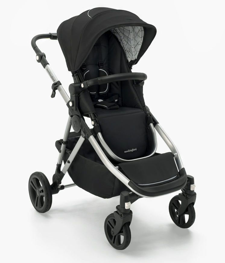 A modern black Mockingbird Single-to-Double Stroller 2.0 baby stroller with adjustable handle, reclining seat, and swivel wheels, isolated on a white background.  #color_black