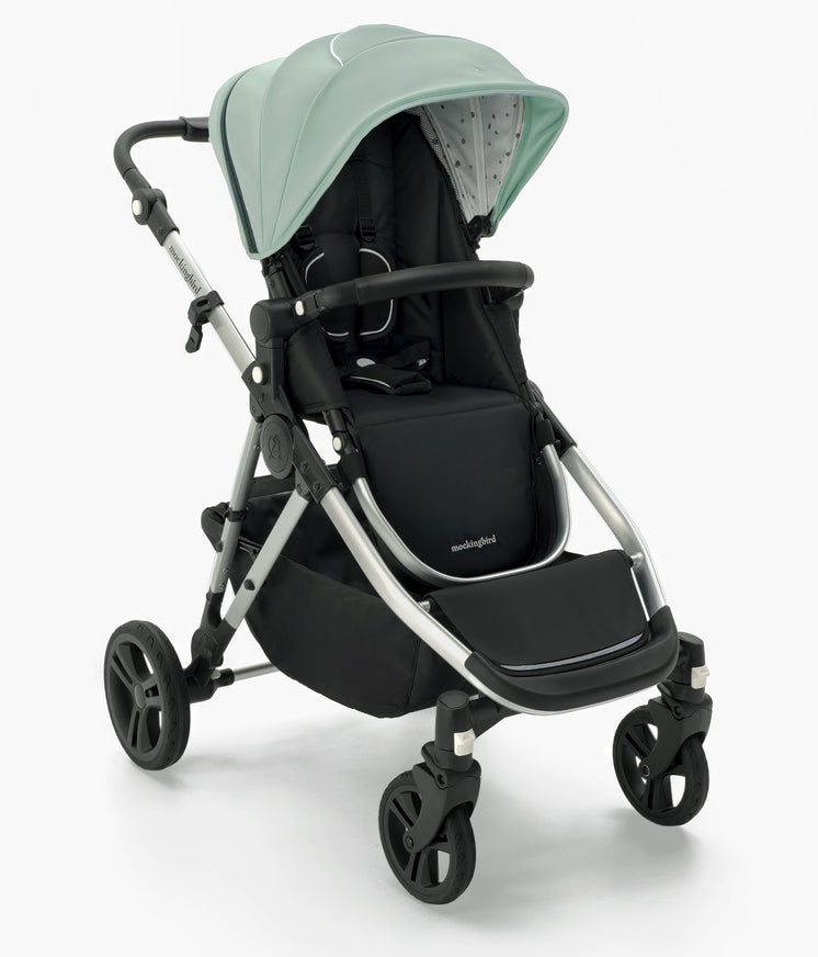 A modern Mockingbird Single-to-Double Stroller 2.0 with a mint green canopy, black seat, and gray frame on a white background. #color_sage
