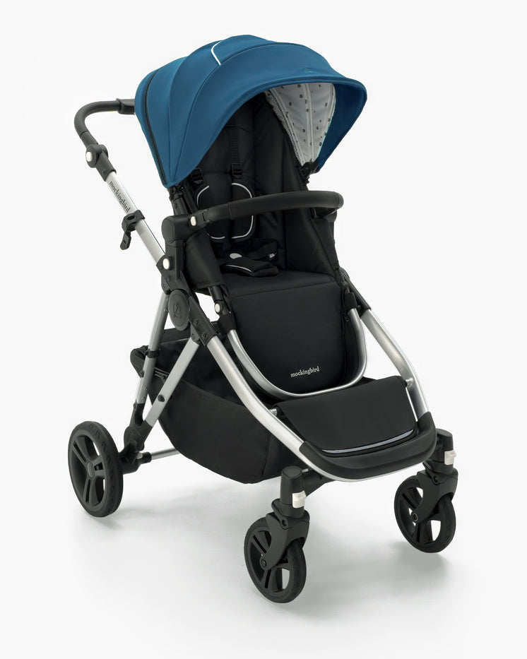 A modern blue and black mockingbird-prod Mockingbird Single-to-Double Stroller 2.0 with a retractable canopy and large rear wheels, isolated on a white background. #color_sea