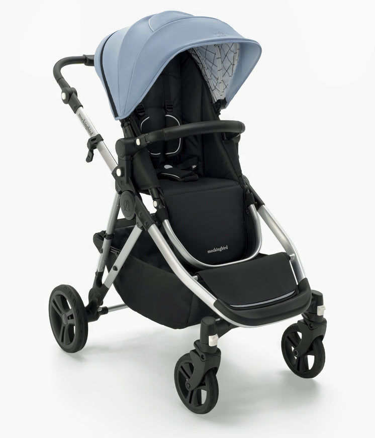 Modern Mockingbird-prod Mockingbird Single-to-Double Stroller 2.0 in light blue and black, featuring a large canopy, adjustable handle, and sturdy wheels on a white background. #color_sky