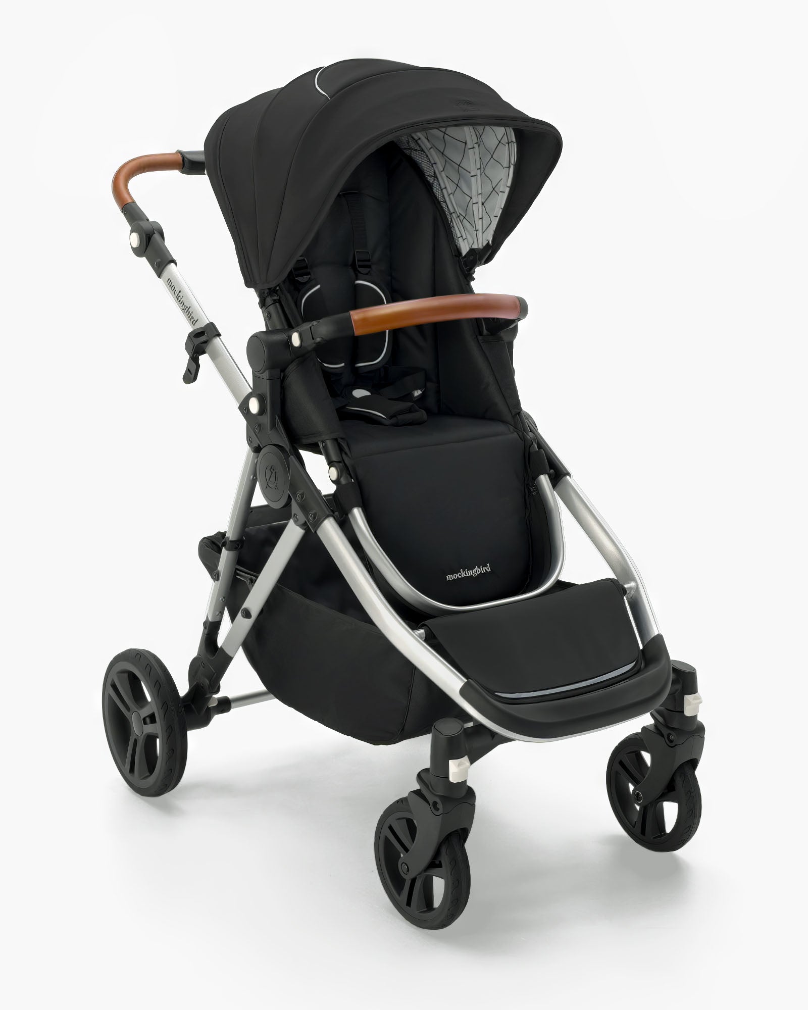 Modern black Mockingbird Single-to-Double Stroller 2.0 with brown handles, adjustable hood, sturdy wheels, and a mockingbird-prod label, isolated on a white background. #color_black