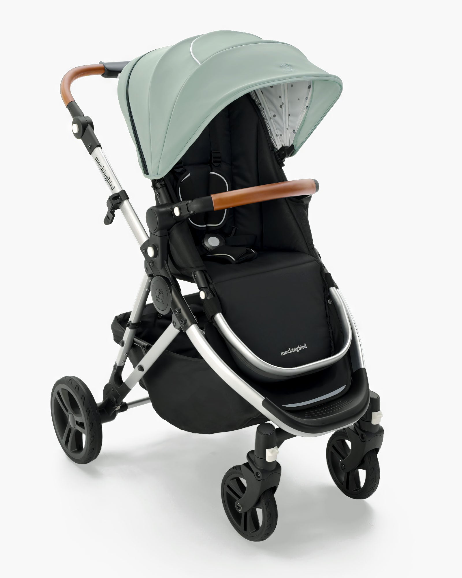 Modern Mockingbird Single Stroller 2.0 with a mint green canopy, black seat, and brown leather handles by mockingbird, isolated on a white background. #color_sage