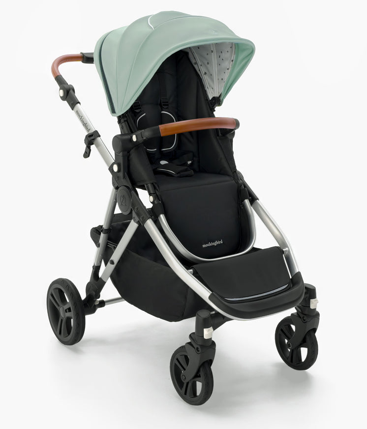 Modern Mockingbird Single-to-Double Stroller 2.0 baby stroller in mint green with an adjustable canopy and reclining black seat, isolated on a white background. #color_sage