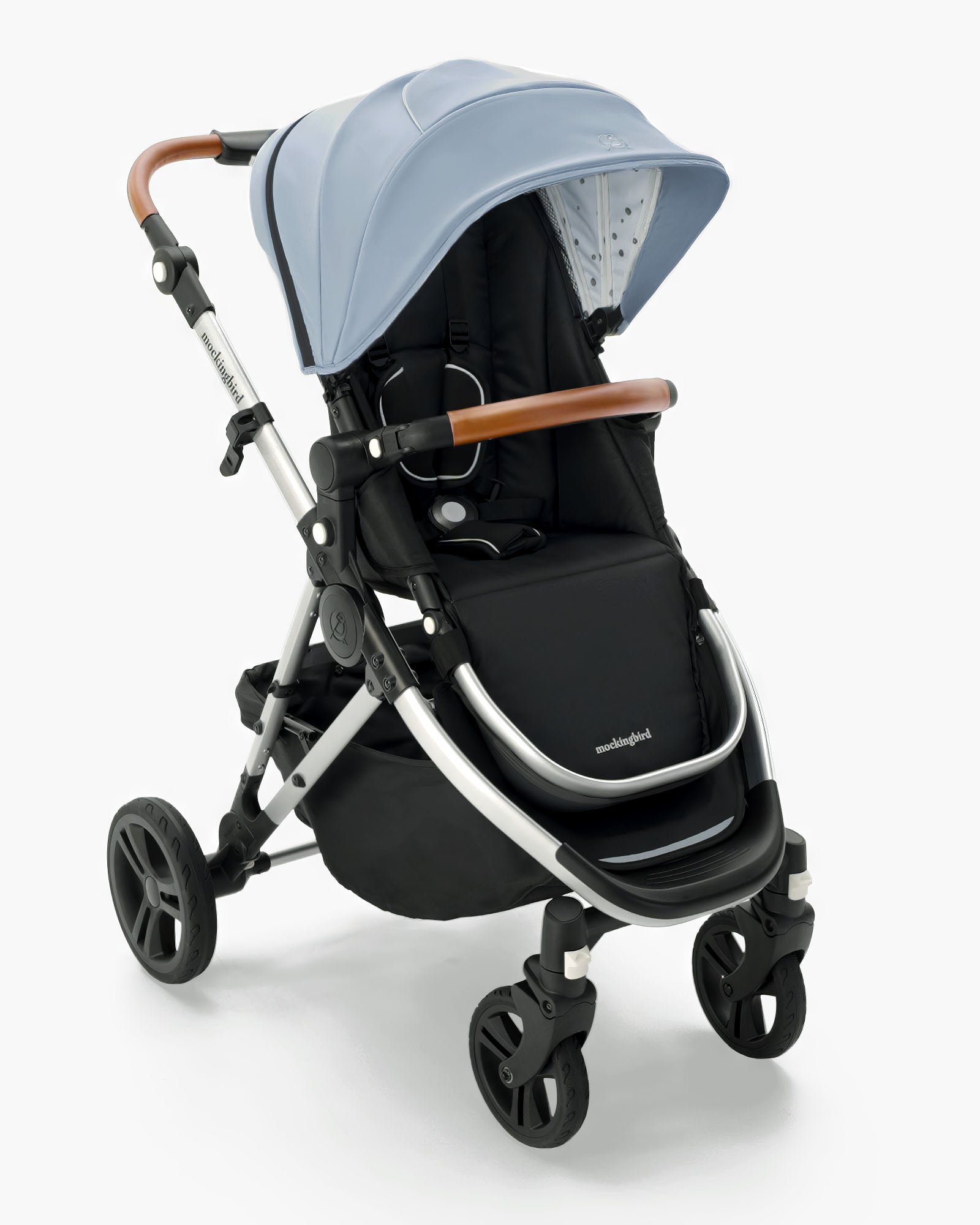 A modern Mockingbird Single Stroller 2.0 in black with a pale blue canopy, featuring an adjustable handle and large wheels, isolated on a white background from mockingbird #color_sky