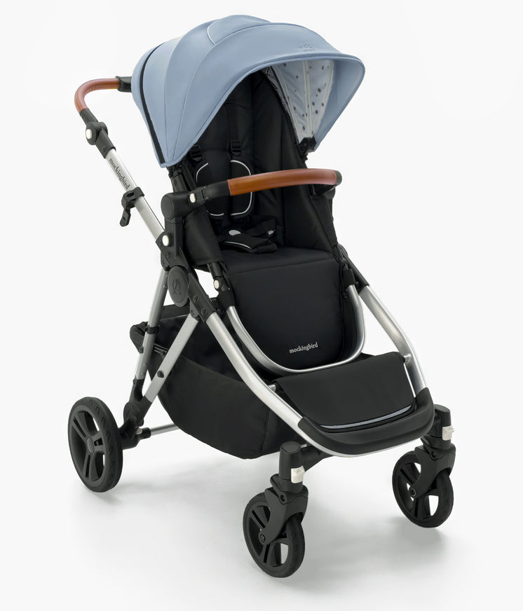 Modern Mockingbird Single-to-Double Stroller 2.0 with blue sunshade, adjustable handle, and four wheels, isolated on a white background by mockingbird. #color_sky