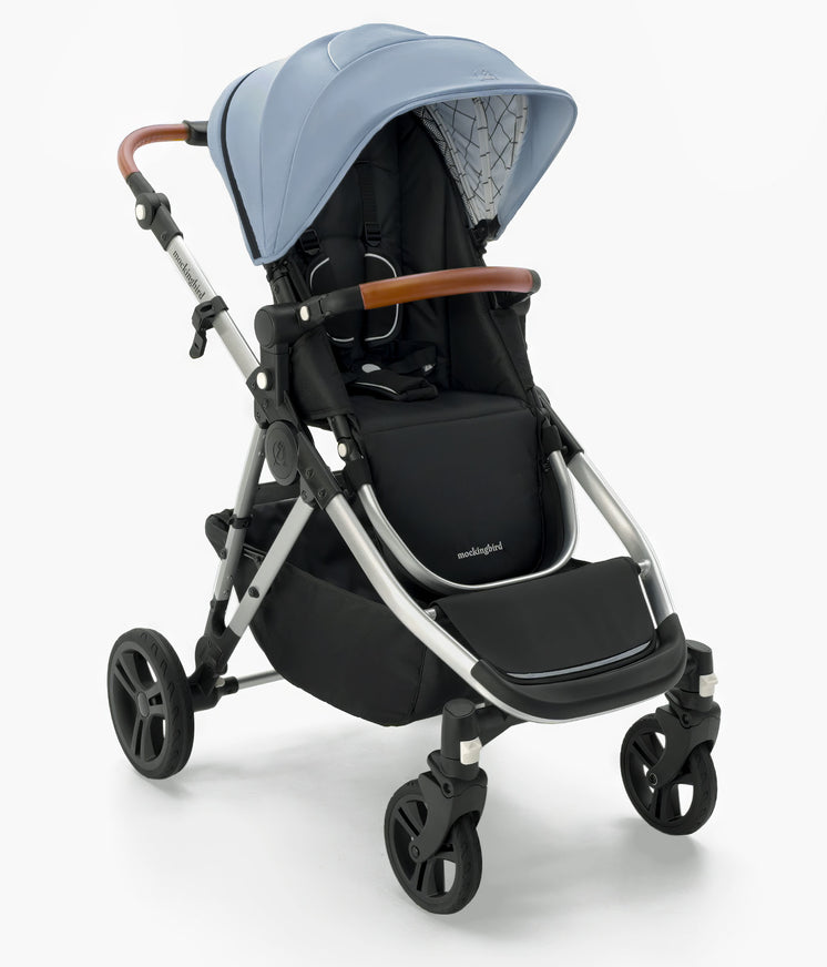 Modern Mockingbird Single-to-Double Stroller 2.0 baby stroller with blue canopy, black seat, and brown handles on a white background. #color_sky