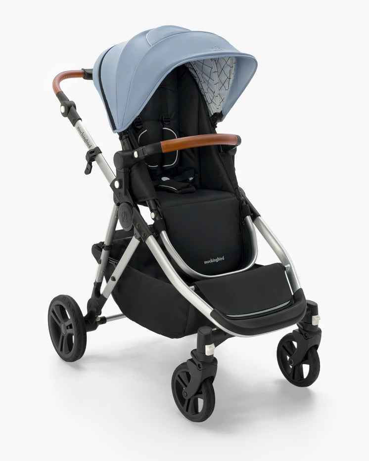 Modern Mockingbird Single-to-Double Stroller 2.0 baby stroller with blue canopy, black seat, and brown handles on a white background. #color_sky