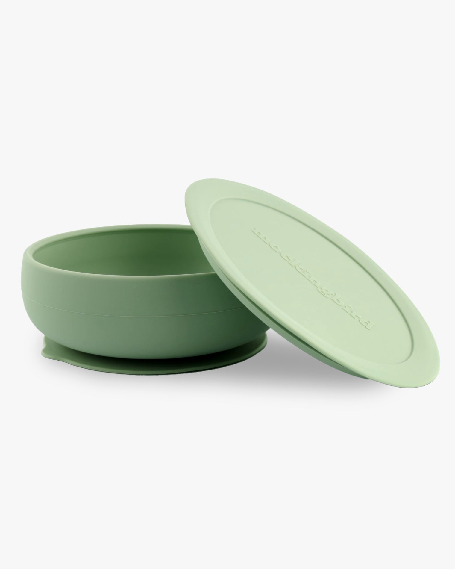 Mockingbird dishware set showing the sage green bowl and lid