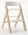 3/4 front view of mockingbird high chair in studio on light grey background