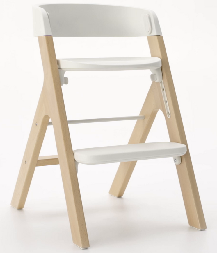 3/4 front view of mockingbird high chair in studio on light grey background