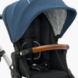 Close-up of a modern mockingbird-prod Mockingbird stroller with an extra mockingbird-prod Stroller Canopy 2.0, black seat, and a brown leather handle. #color_sea