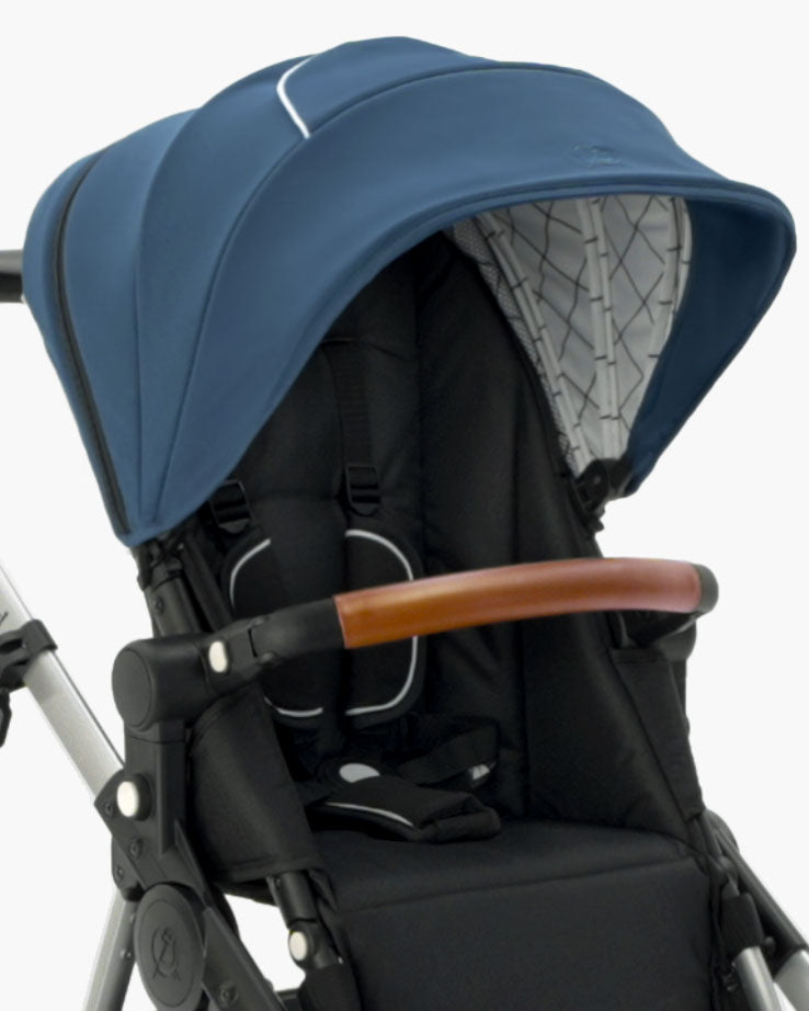 Close-up of a modern mockingbird-prod Mockingbird stroller with an extra mockingbird-prod Stroller Canopy 2.0, black seat, and a brown leather handle. #color_sea