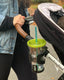Mockingbird stroller with green travel cup in cupholder
